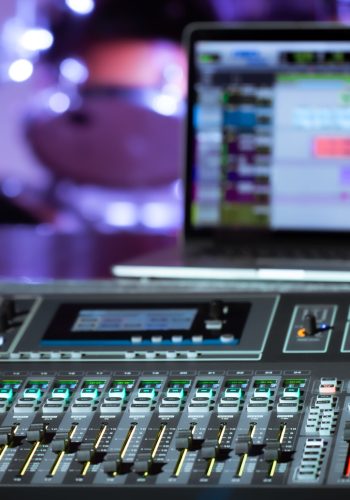 Digital mixer in a recording Studio , with a computer for recording music. The concept of creativity and show business. Digital mixer in a recording Studio , with a computer for recording music. The concept of creativity and show business. Space for text.
